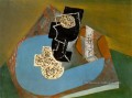 Verre et paquet tabac sur une table 1914 cubiste Pablo Picasso